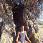 Paul Vishal meditation on a beach in Ibiza Spain